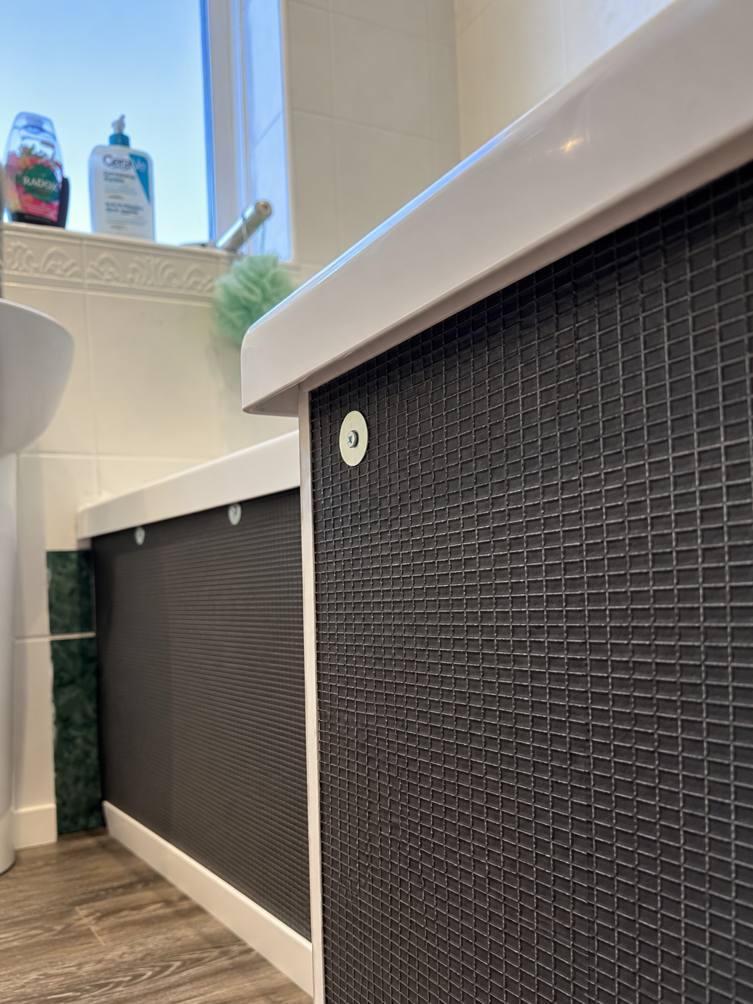 Waterproof tile backer board fitted as a tiled bath panel substrate in Basildon