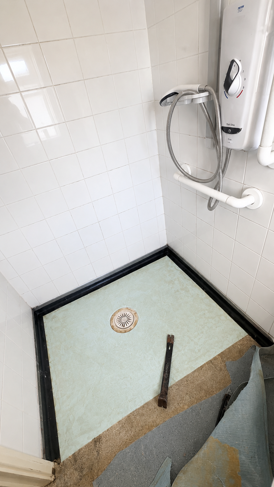 Old shower tray removed during bathroom renovation in Billericay