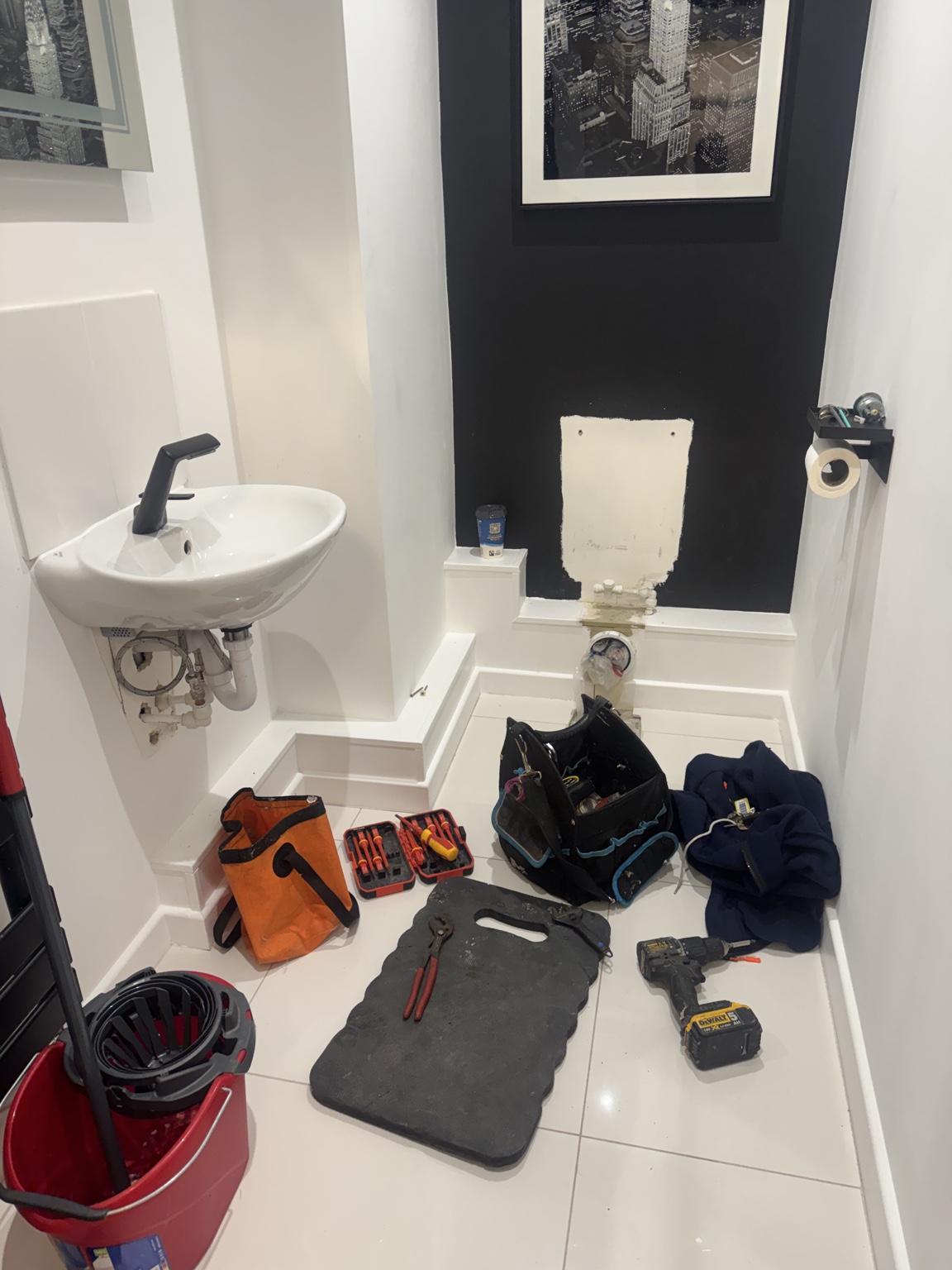 Chelmsford cloakroom stripped back before new vanity unit and concealed cistern toilet installation
