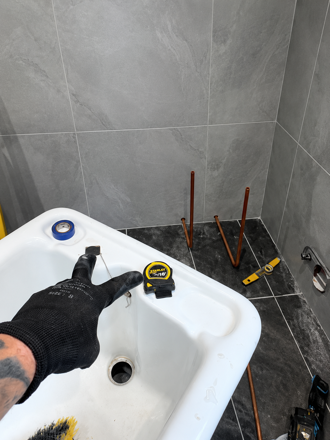 First-fix copper pipework prepared through the floor for freestanding bath taps in Brentwood
