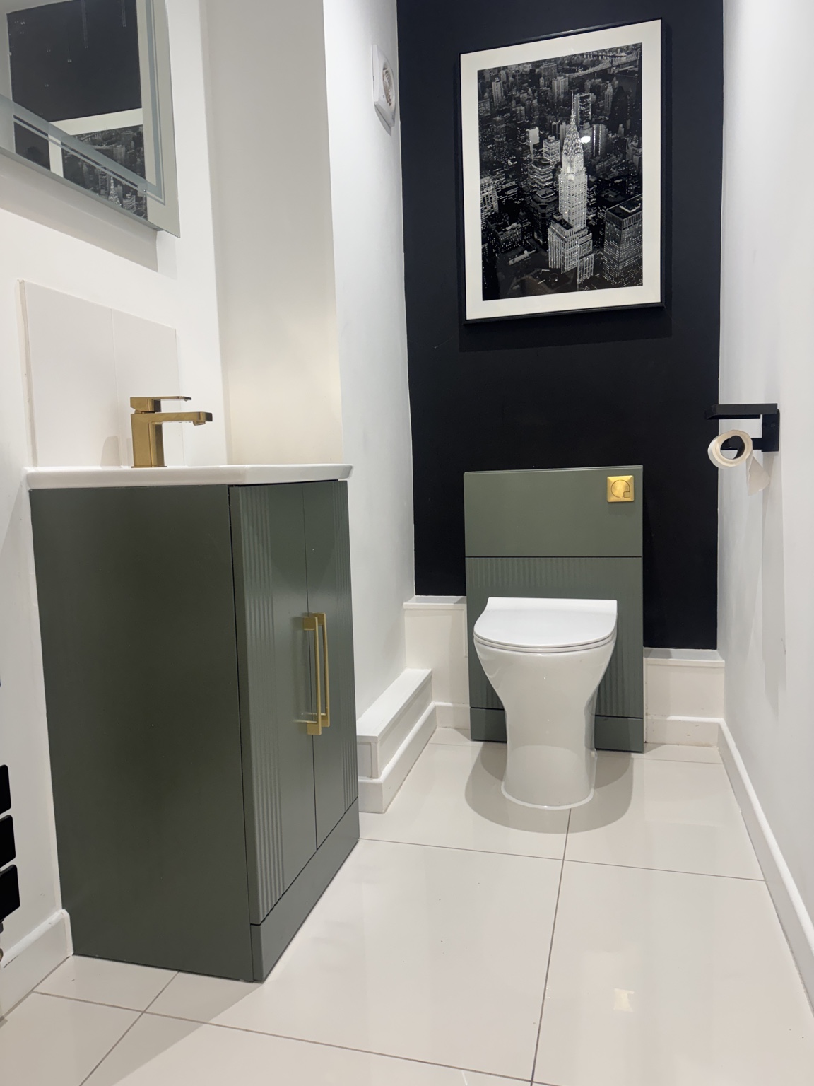 Completed Chelmsford cloakroom with green fluted vanity unit and concealed cistern toilet