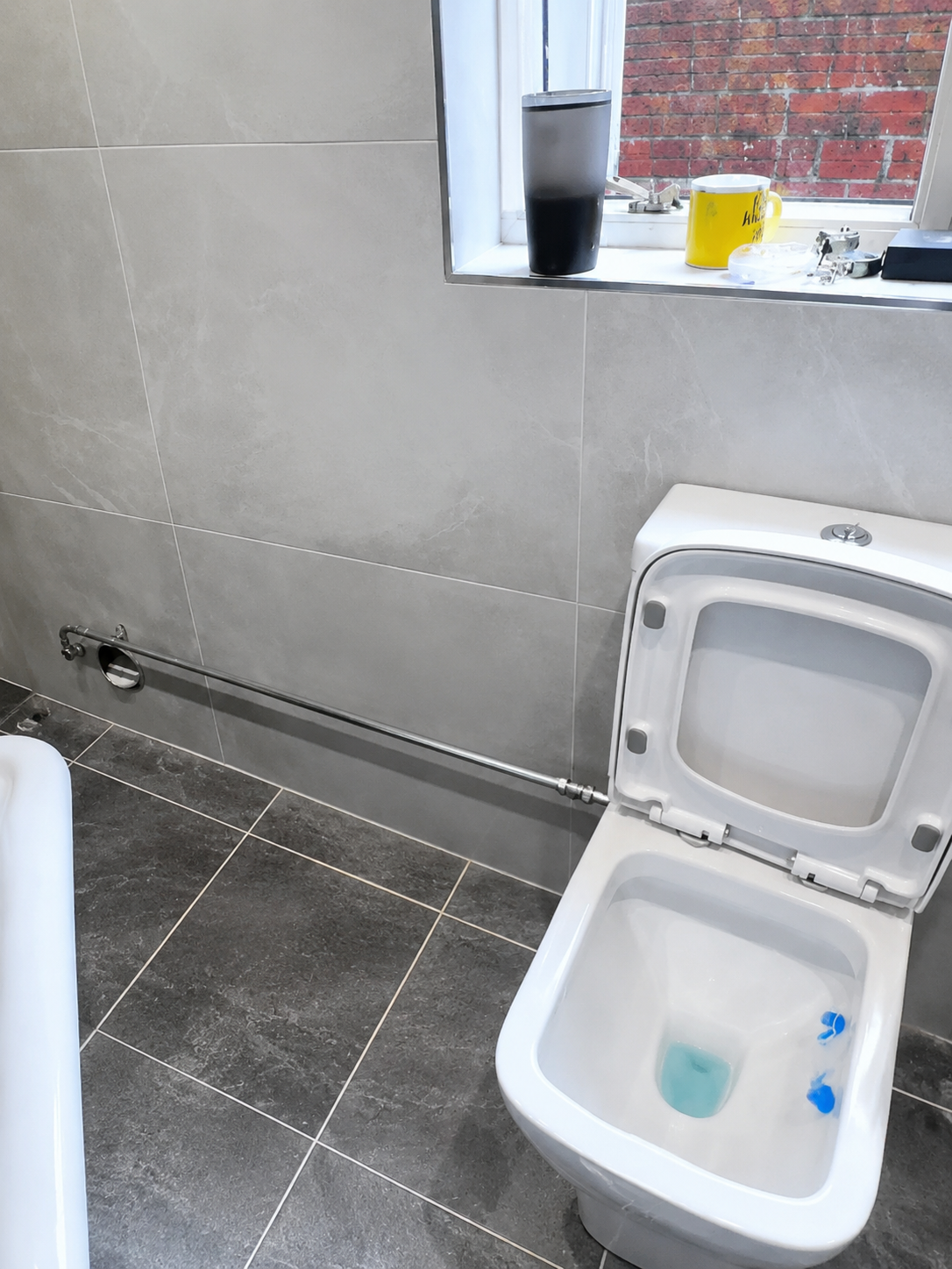 Relocated toilet pipework creating extra clearance for a Victorian roll top bath installation in Brentwood